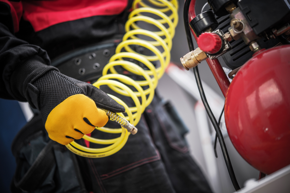 Air,compressor,in,a,hand.,professional,auto,service,equipment.